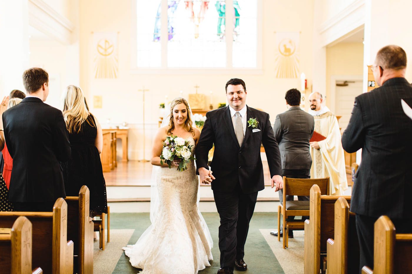 church-ceremony-jenn-pete-hand-in-hand-walking-down-the-aisle